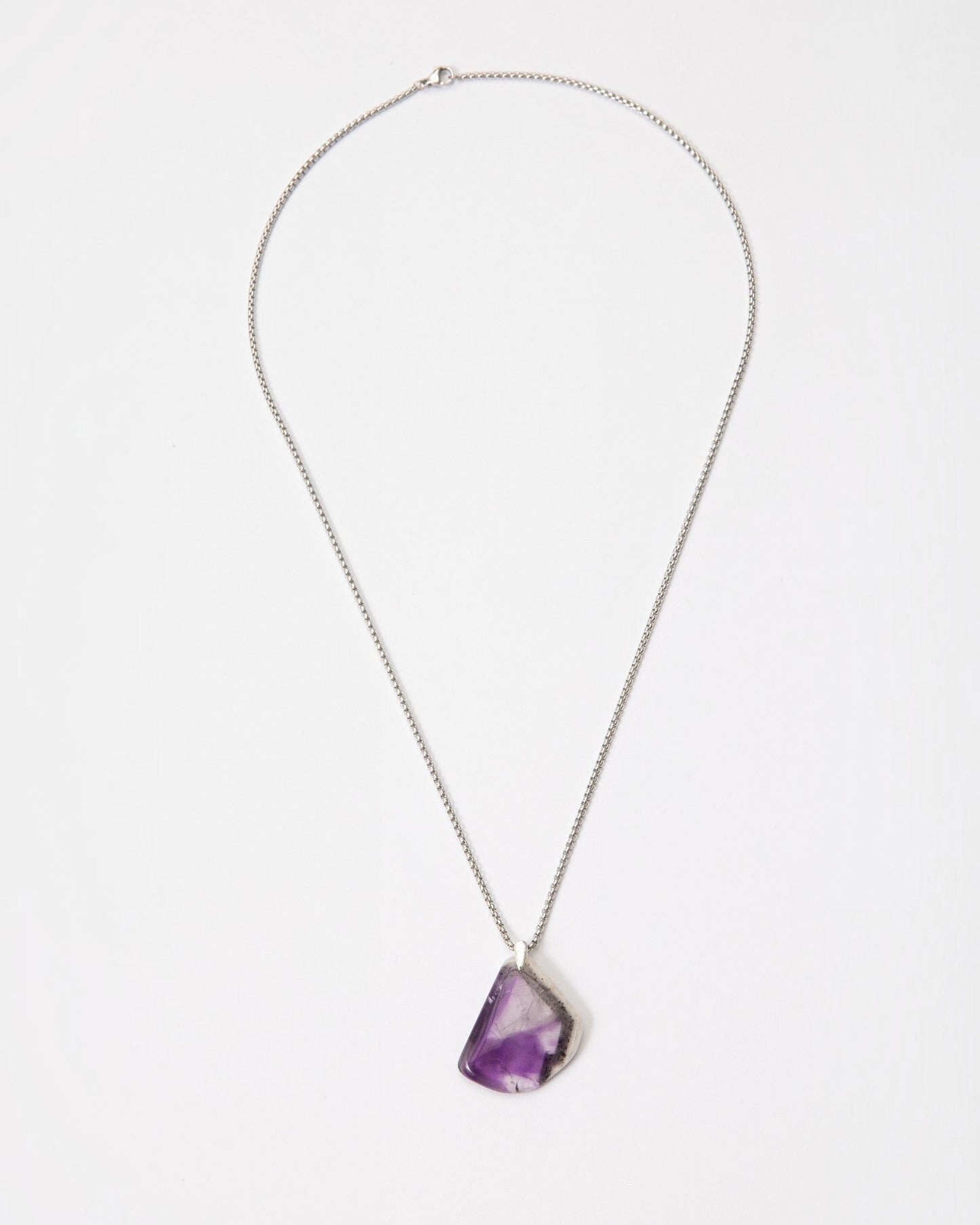 Elsita Jewelry Kaleidoscope I amethyst pendant necklace with raw purple crystal and sterling silver on a steel chain.