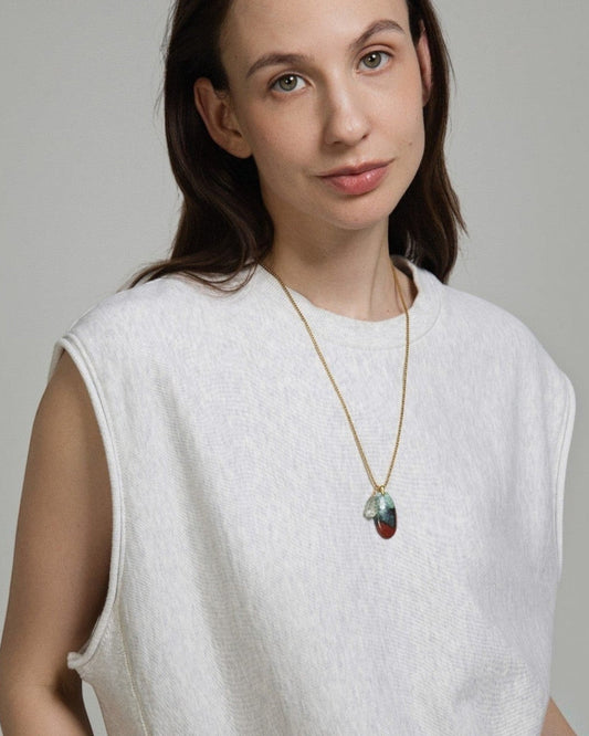 Elsita Jewelry Horizon IV necklace featuring a Sonora sunset stone and green quartz pendant on a gold-tone chain.