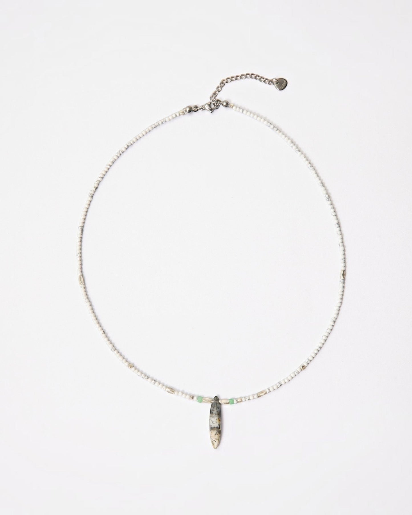 Elsita Jewelry Snowline Grey necklace featuring white howlite beads, grey agate pendant, and sterling silver accents.
