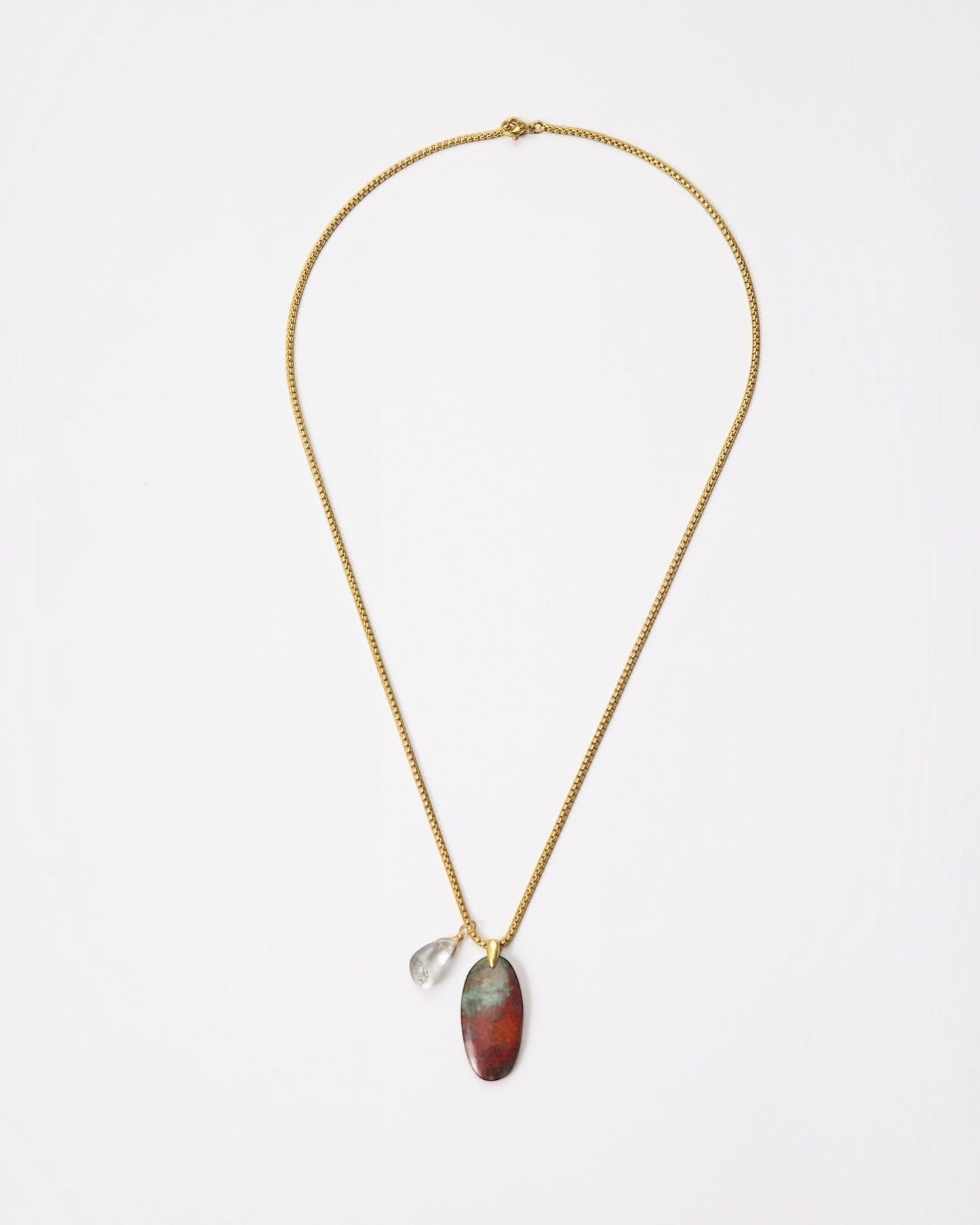 Elsita Jewelry Horizon IV necklace featuring an oval Sonora sunset stone and green quartz on a gold-tone chain.