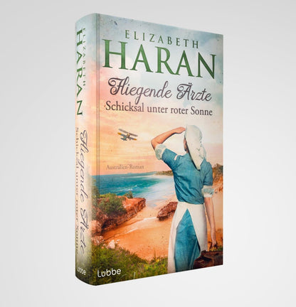 Lübbe Paperback Fliegende Ärzte - Schicksal unter roter Sonne (Deutsch, 2024, Elizabeth Haran)