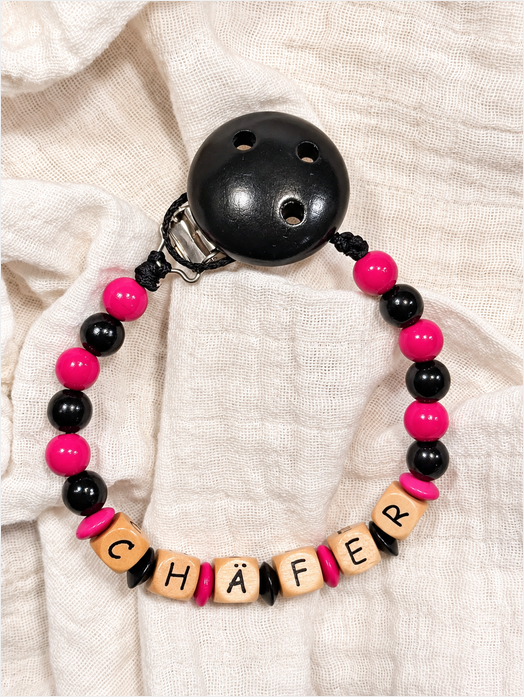 Nuggikette "Chäfer" (Farbe: pink, schwarz Material: Holz)