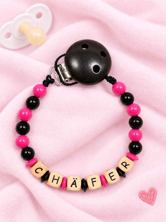 Nuggikette "Chäfer" (Farbe: pink/schwarz, Material: Holz)