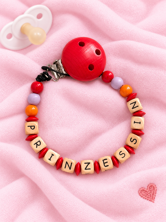 Nuggikette "Prinzessin" (Farbe: rot, lila, orange Material: Holz)