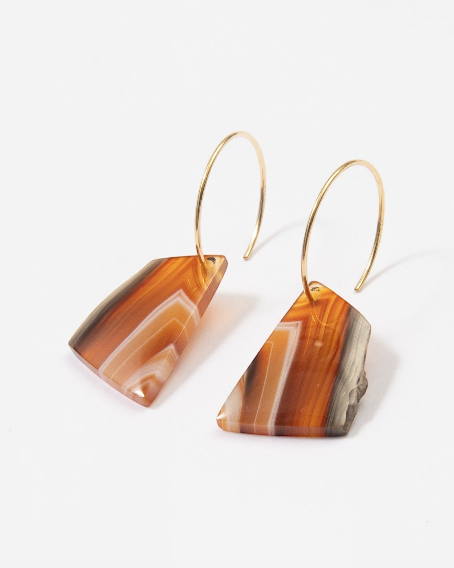 Elsita Jewelry Wild 11 agate earrings featuring freeform orange and brown banded stone slices on 14K gold-filled hoops.
