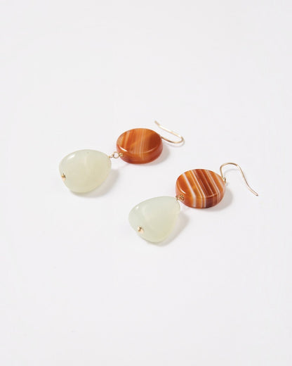 Elsita Jewelry Dawn earrings featuring round red banded agate and triangular Xiuyan jade on 14K gold-filled hooks.