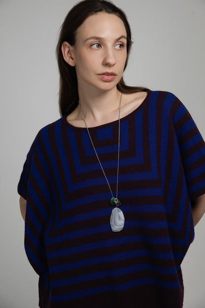 Model wearing an Elsita Jewelry Glacier Night necklace featuring white agate, green agate, and smoky quartz on a chain.