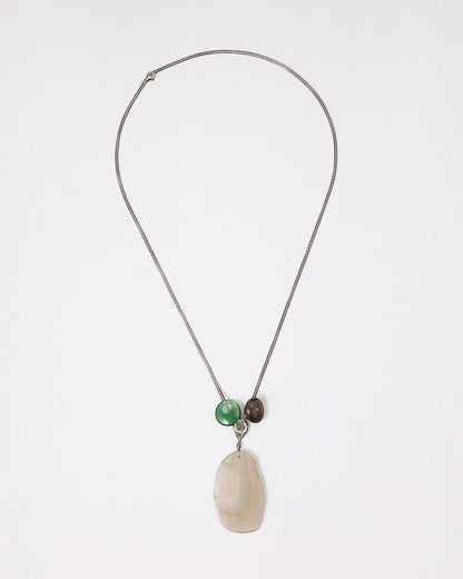 Elsita Jewelry Glacier Night necklace featuring a white agate slice, green agate ring, and smoky quartz on a silver chain.