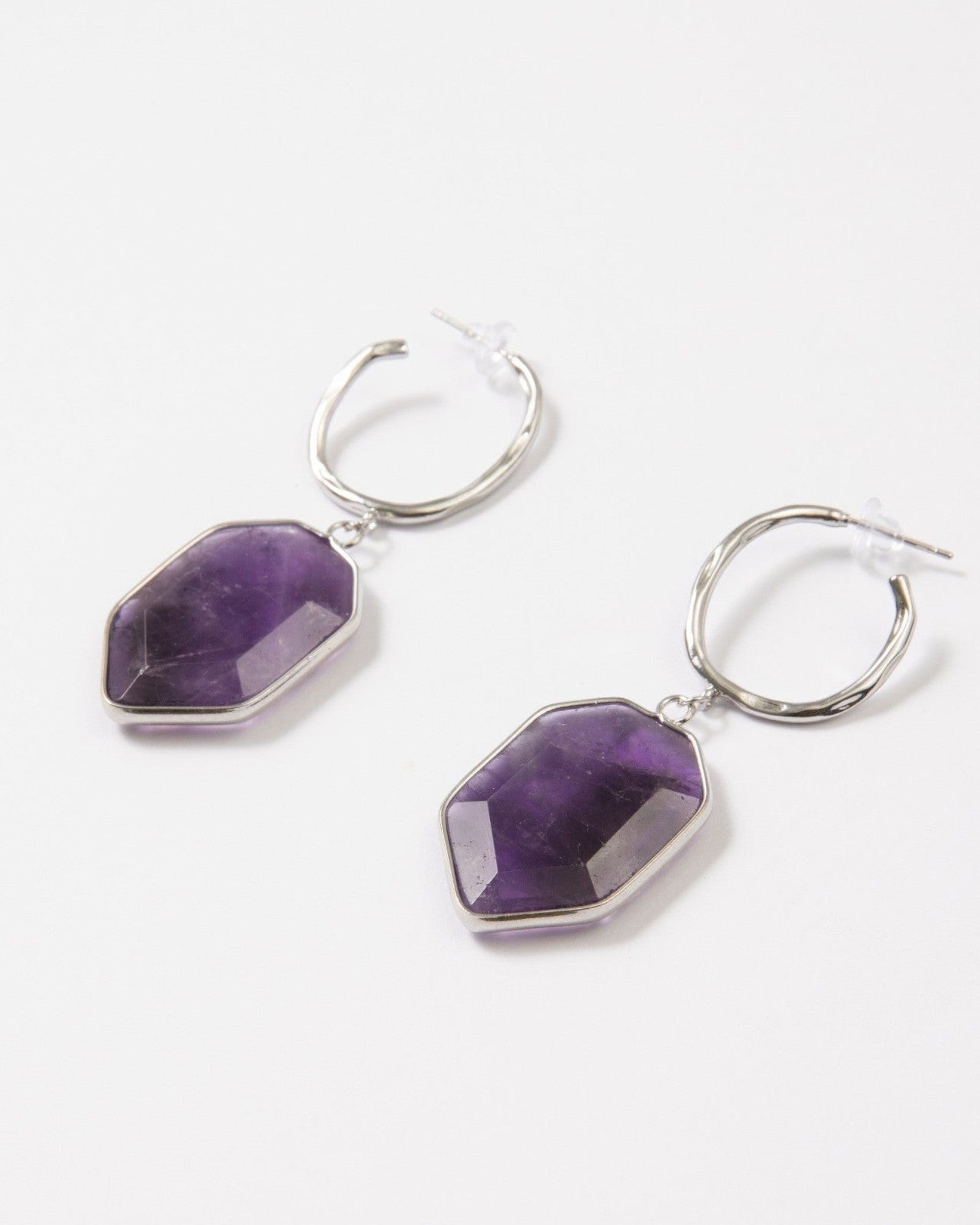 Elsita Jewelry Calm amethyst earrings featuring geometric dark violet stones on sterling silver hoop posts.