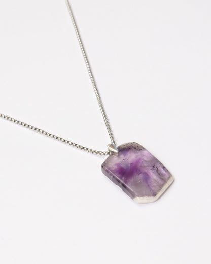 Elsita Jewelry Kaleidoscope II amethyst pendant necklace with white quartz edge on a stainless steel chain.
