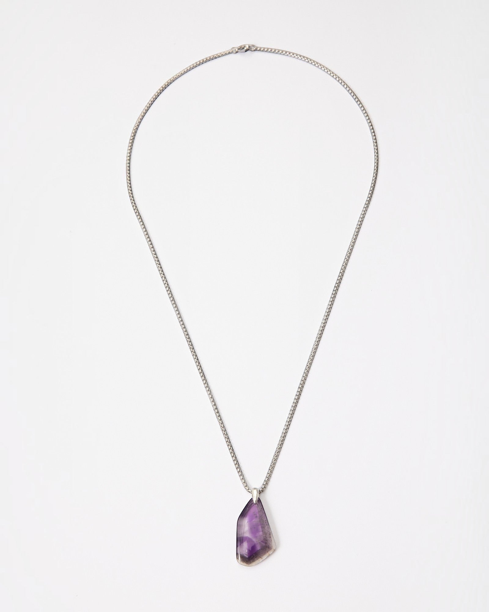 Elsita Jewelry Kaleidoscope III amethyst pendant necklace with a raw purple crystal stone on a sterling silver chain.