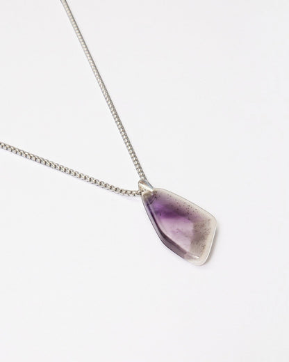 Elsita Jewelry Kaleidoscope IV amethyst pendant necklace with a sterling silver bail on a stainless steel chain.