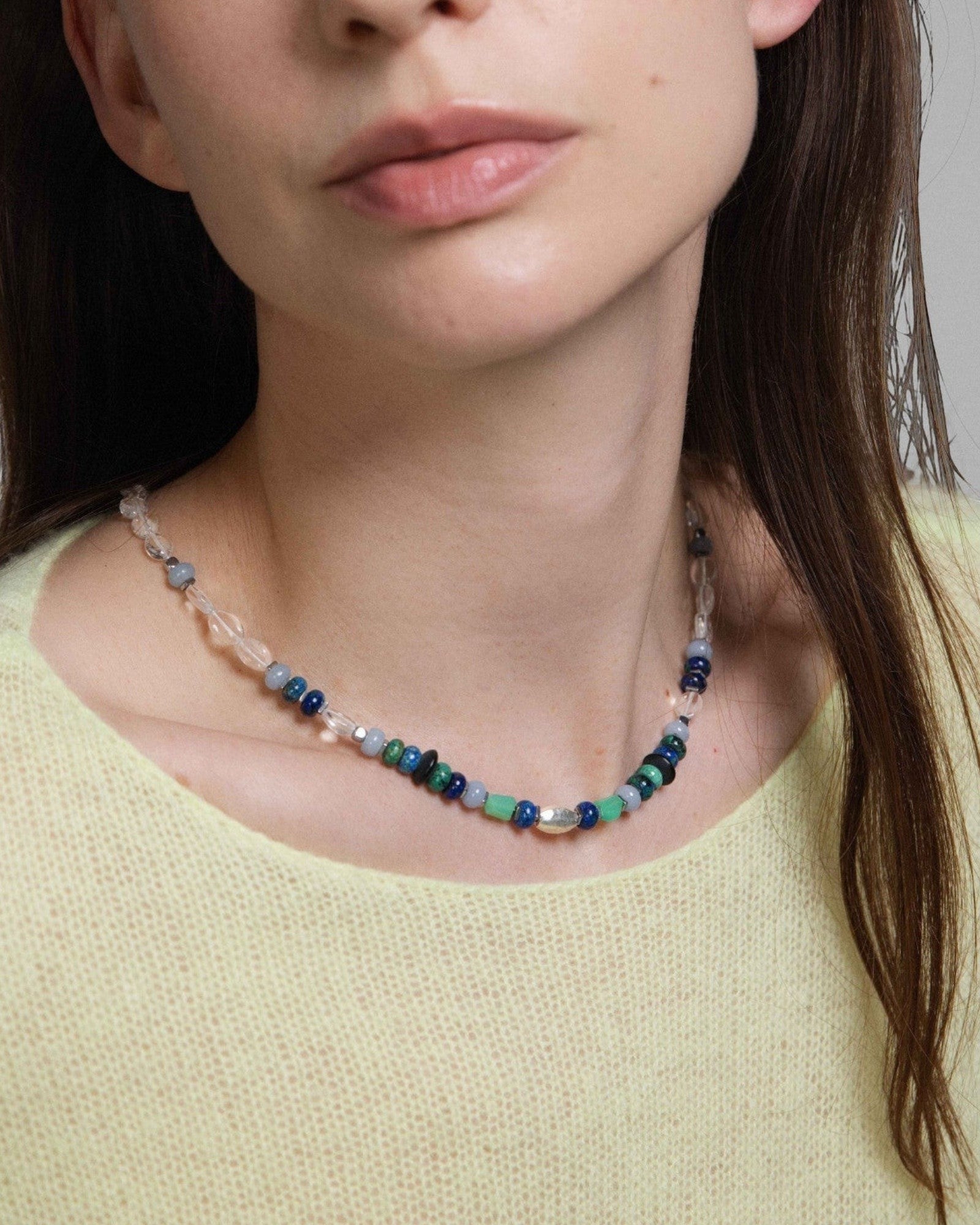 Elsita Jewelry Blausee Light necklace featuring mixed Chrysocolla, Chrysoprase, and Clear Quartz beads on a model.