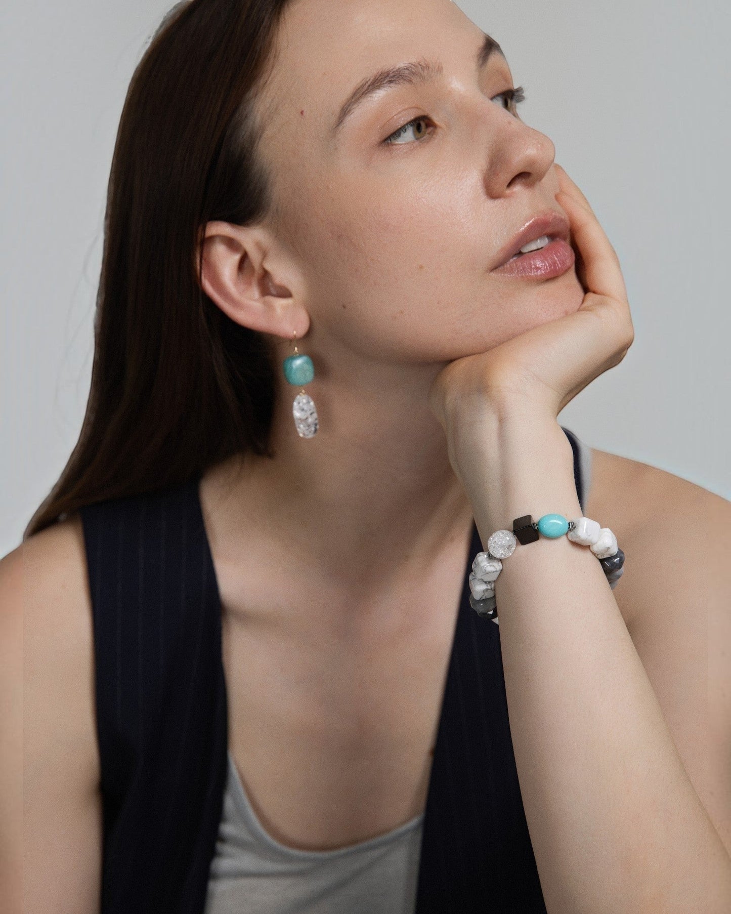 Elsita Jewelry Chill bracelet featuring turquoise, howlite, and agate stones worn by a woman with matching earrings.