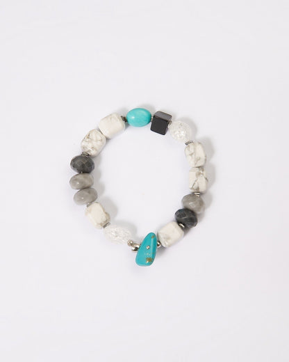 Elsita Jewelry Chill bracelet featuring turquoise, howlite, agate, and quartz beads in a cool-toned mineral composition.