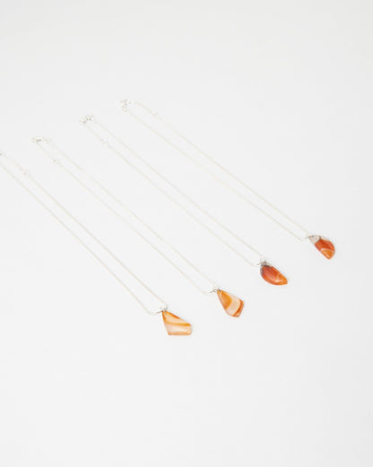 Elsita Jewelry Citrus I necklaces featuring small orange agate stone pendants on delicate silver chains