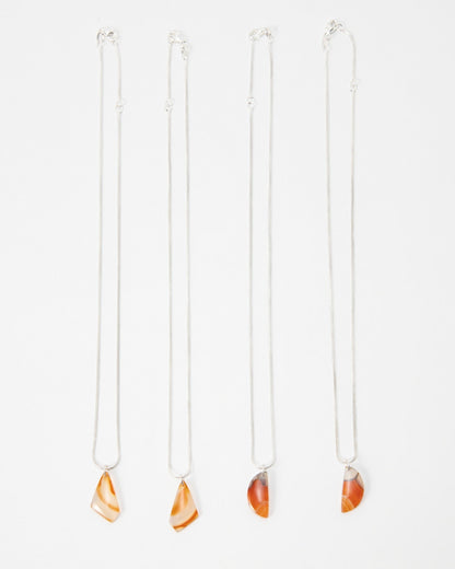 Elsita Jewelry Citrus I necklaces featuring orange agate stone pendants on delicate silver chains