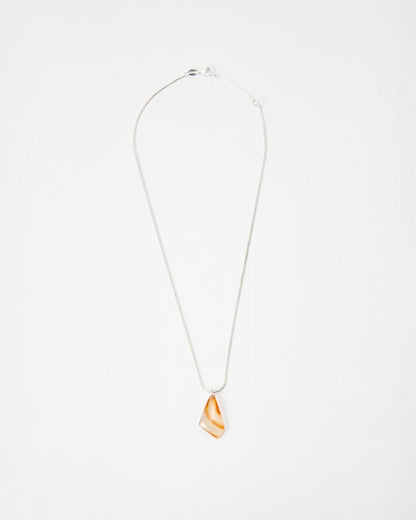 Elsita Jewelry Citrus II necklace featuring a translucent orange and white agate pendant on a delicate silver chain