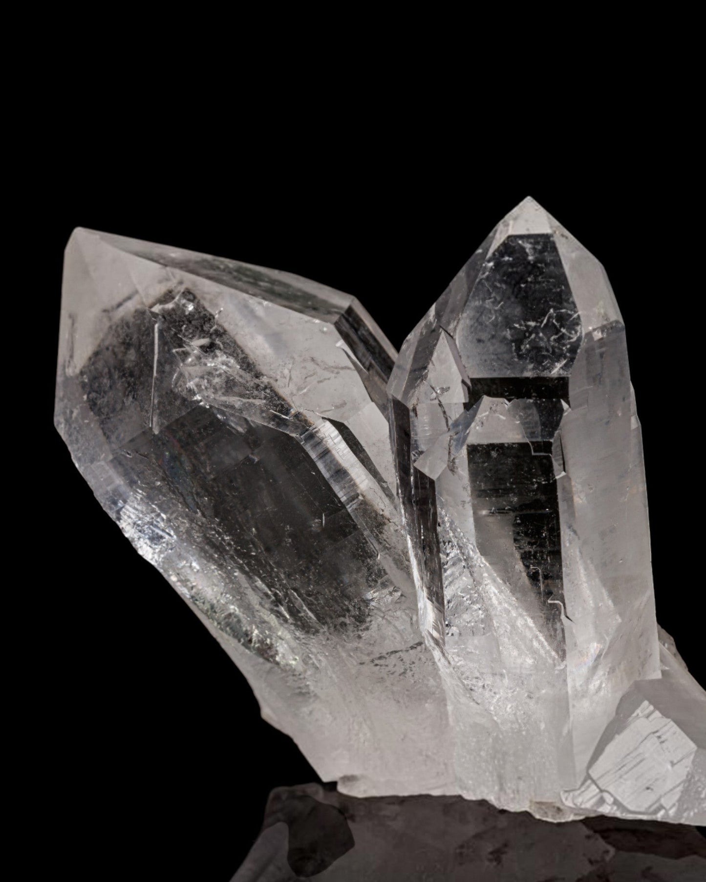 Elsita Jewelry clear quartz crystal cluster with faceted points and natural internal clarity on a black background