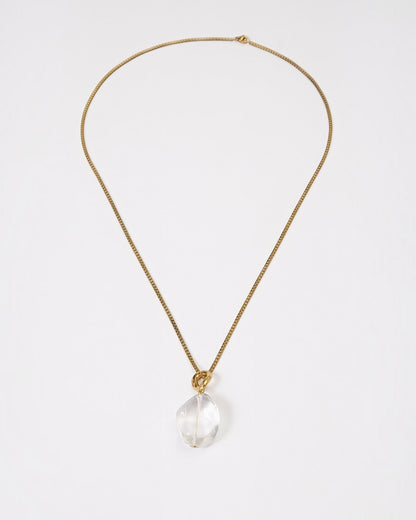 Elsita Jewelry Lustre II necklace featuring a clear quartz pendant on a delicate gold-tone stainless steel chain.