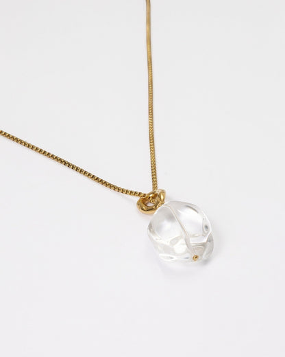 Elsita Jewelry Lustre II necklace featuring a clear quartz pendant on a gold-toned stainless steel chain.