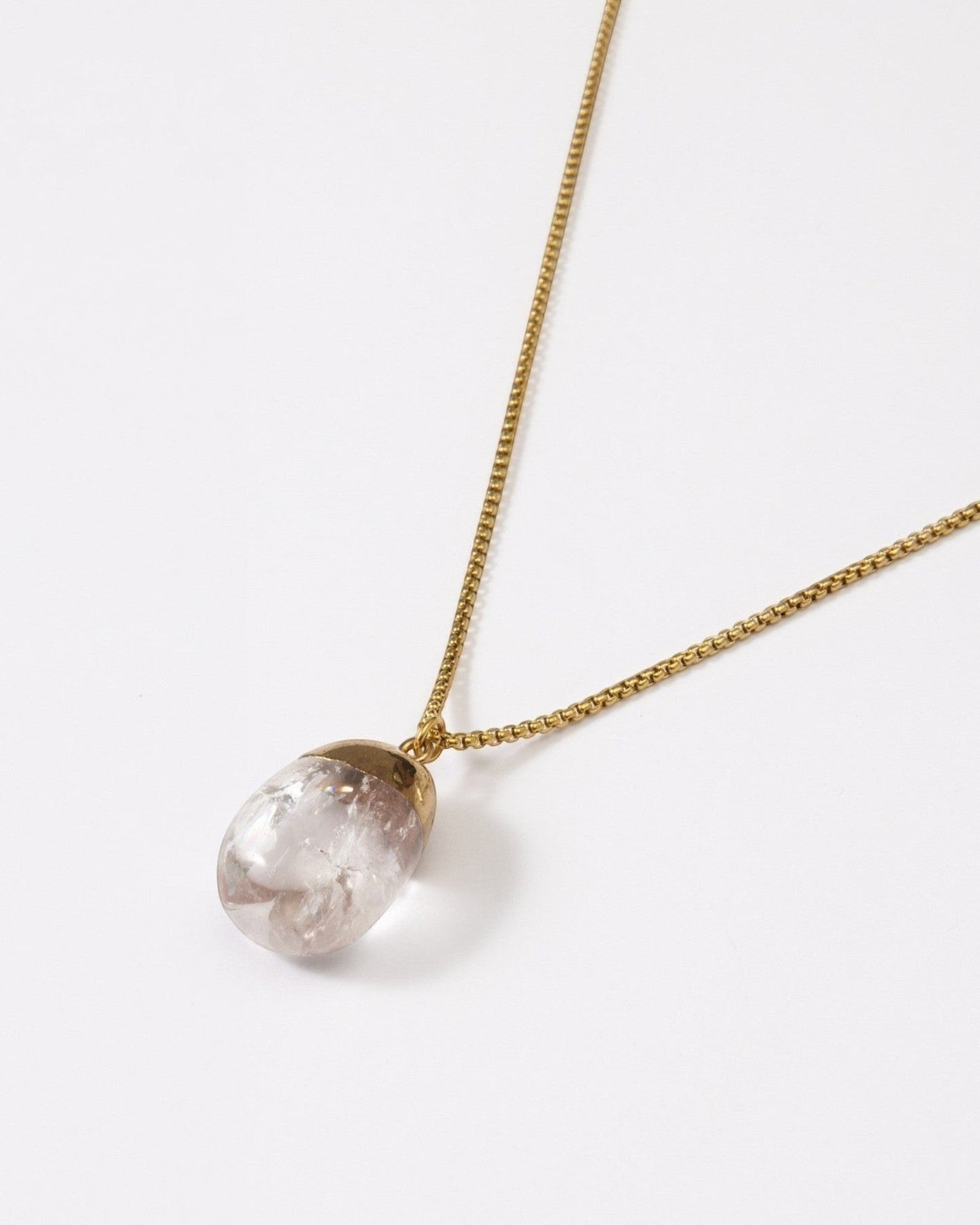 Elsita Jewelry Lustre IV necklace featuring a clear quartz pendant with gold-tone stainless steel on a delicate chain.