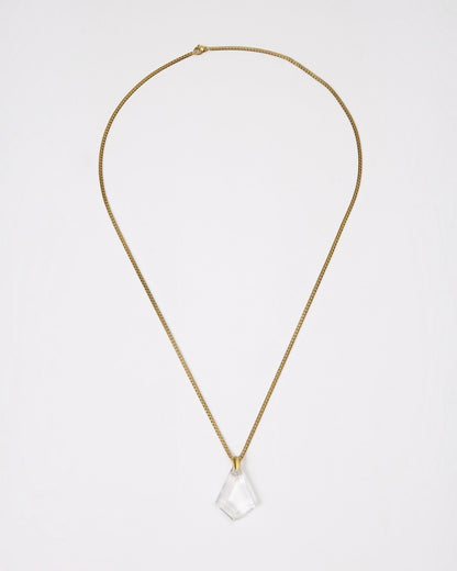 Elsita Jewelry Lustre III necklace featuring a clear quartz pendant on a gold-toned stainless steel chain.