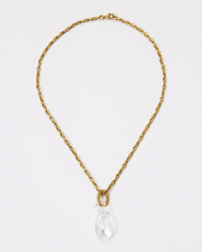 Elsita Jewelry Link Clear necklace featuring a hand-carved clear quartz interlocked chain pendant on a gold chain.