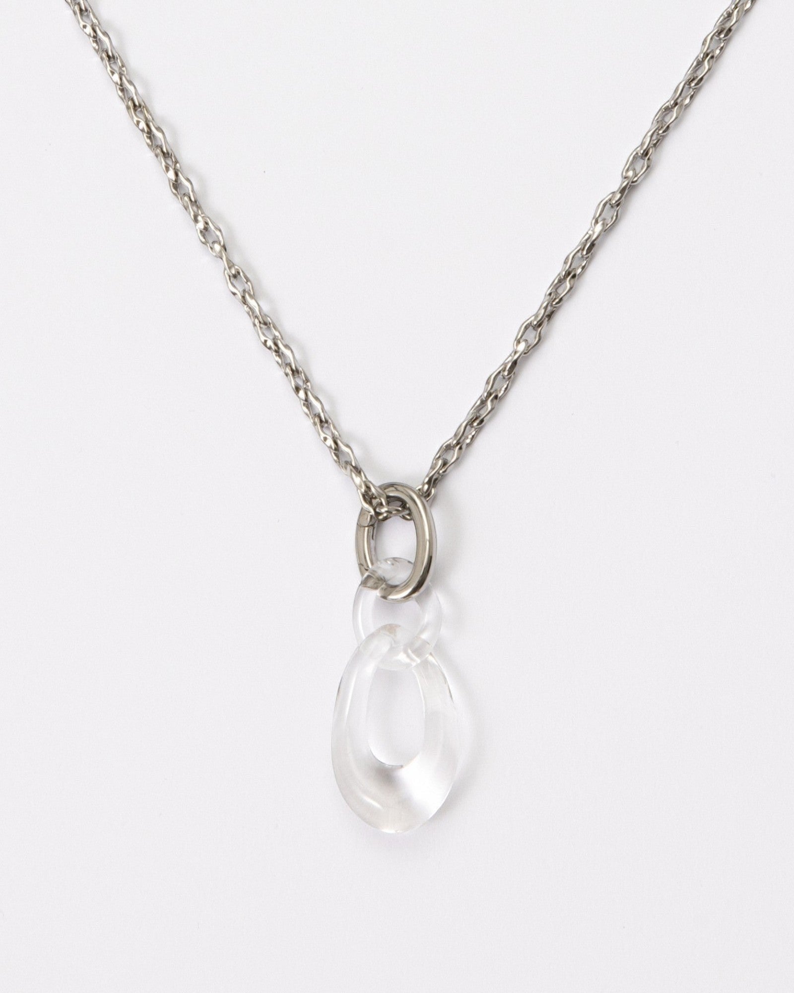 Elsita Jewelry Link Clear necklace featuring a hand-carved clear quartz interlocked chain pendant on a silver-tone chain.