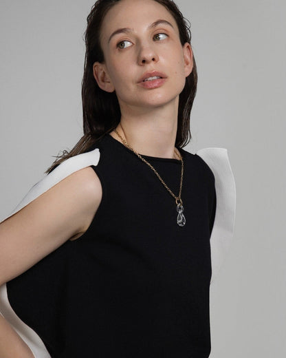Elsita Jewelry Link Clear necklace featuring a hand-carved clear quartz interlocked chain pendant on a gold chain.