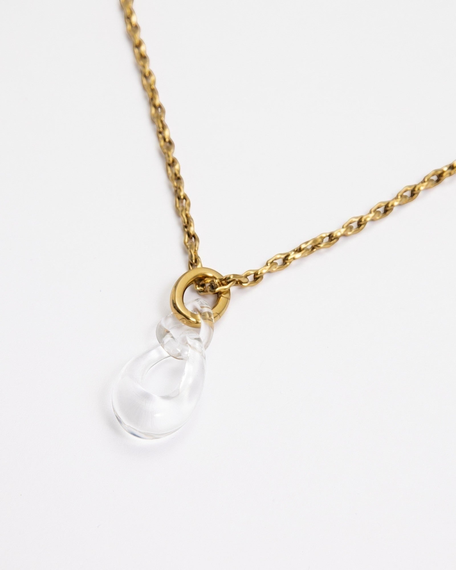 Elsita Jewelry Link Clear necklace featuring a hand-carved clear quartz interlocked chain pendant on a gold-tone chain.