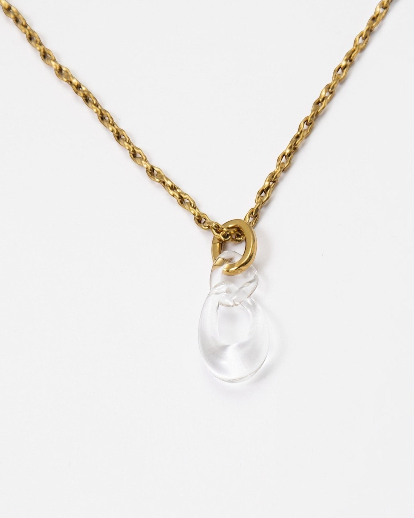 Elsita Jewelry Link Clear necklace featuring a hand-carved clear quartz interlocked chain pendant on a gold-tone chain.