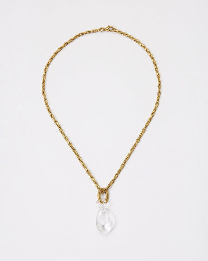 Elsita Jewelry Link Clear necklace featuring a hand-carved clear quartz interlocked chain pendant on a gold chain.