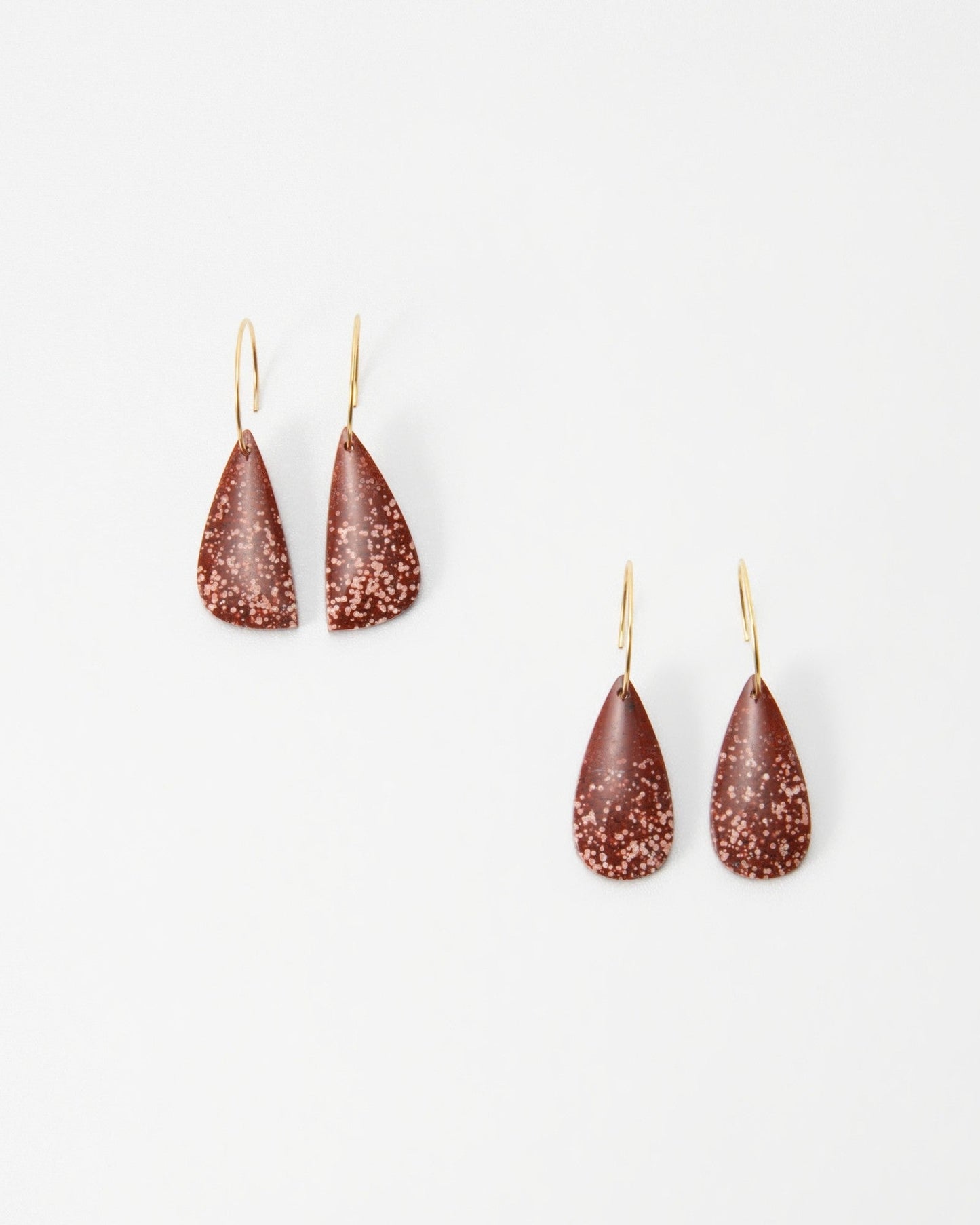 Elsita Jewelry Coral teardrop earrings in terracotta red with white speckled pattern on gold hooks