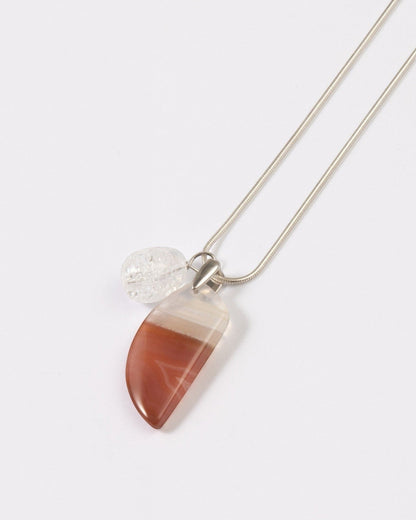 Elsita Jewelry Soda IV crescent red agate and clear quartz pendant necklace on a sterling silver snake chain.