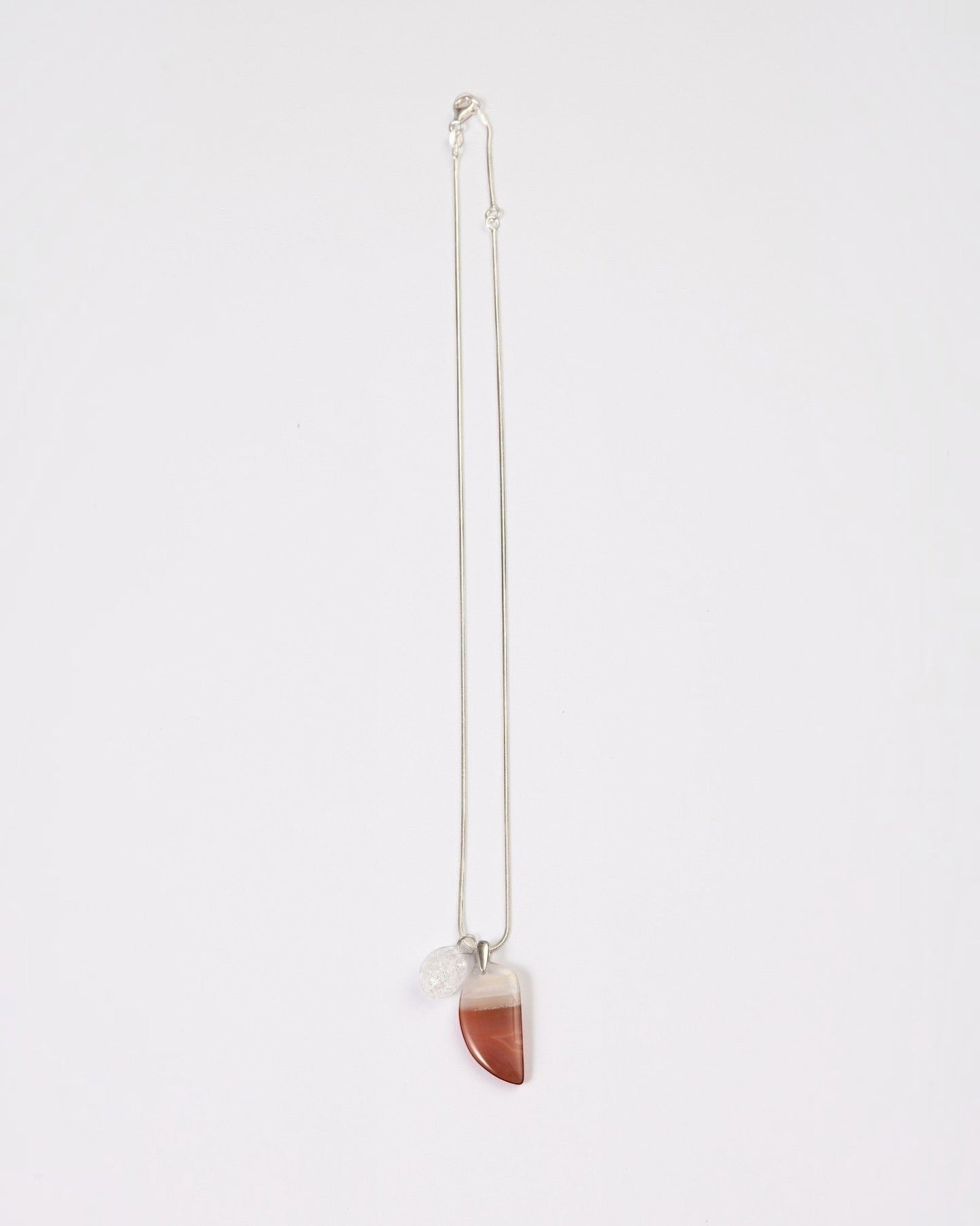 Elsita Jewelry Soda IV crescent red agate and clear quartz pendant necklace on a sterling silver snake chain