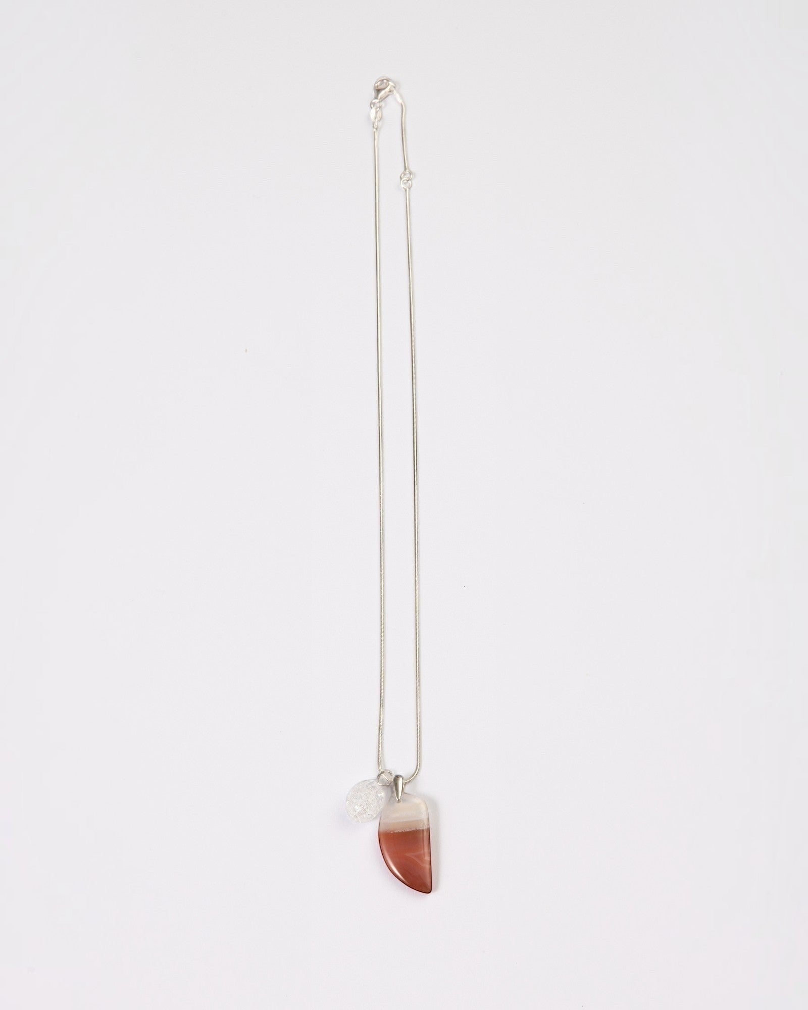 Elsita Jewelry Soda IV crescent red agate and clear quartz pendant necklace on a sterling silver snake chain