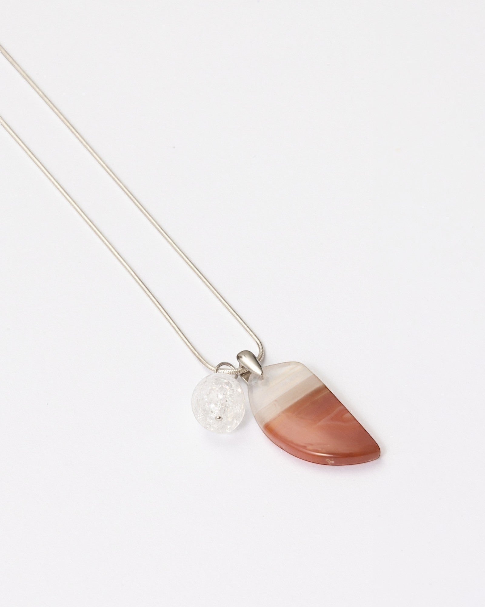 Elsita Jewelry Soda IV crescent red agate and clear quartz pendant necklace on a sterling silver snake chain