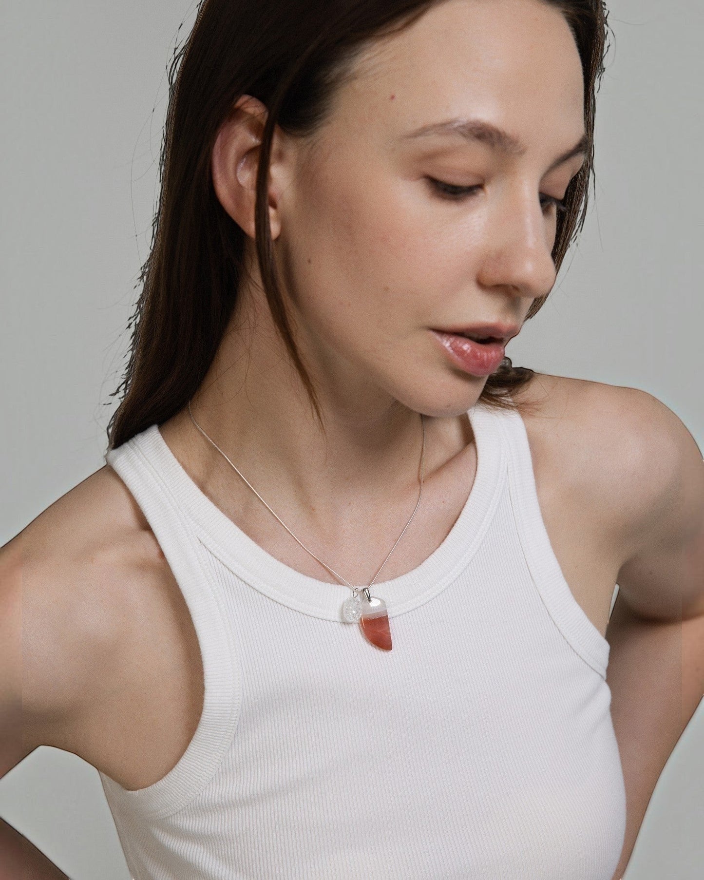 Elsita Jewelry Soda IV necklace featuring a crescent red agate and clear quartz pendant on a sterling silver snake chain