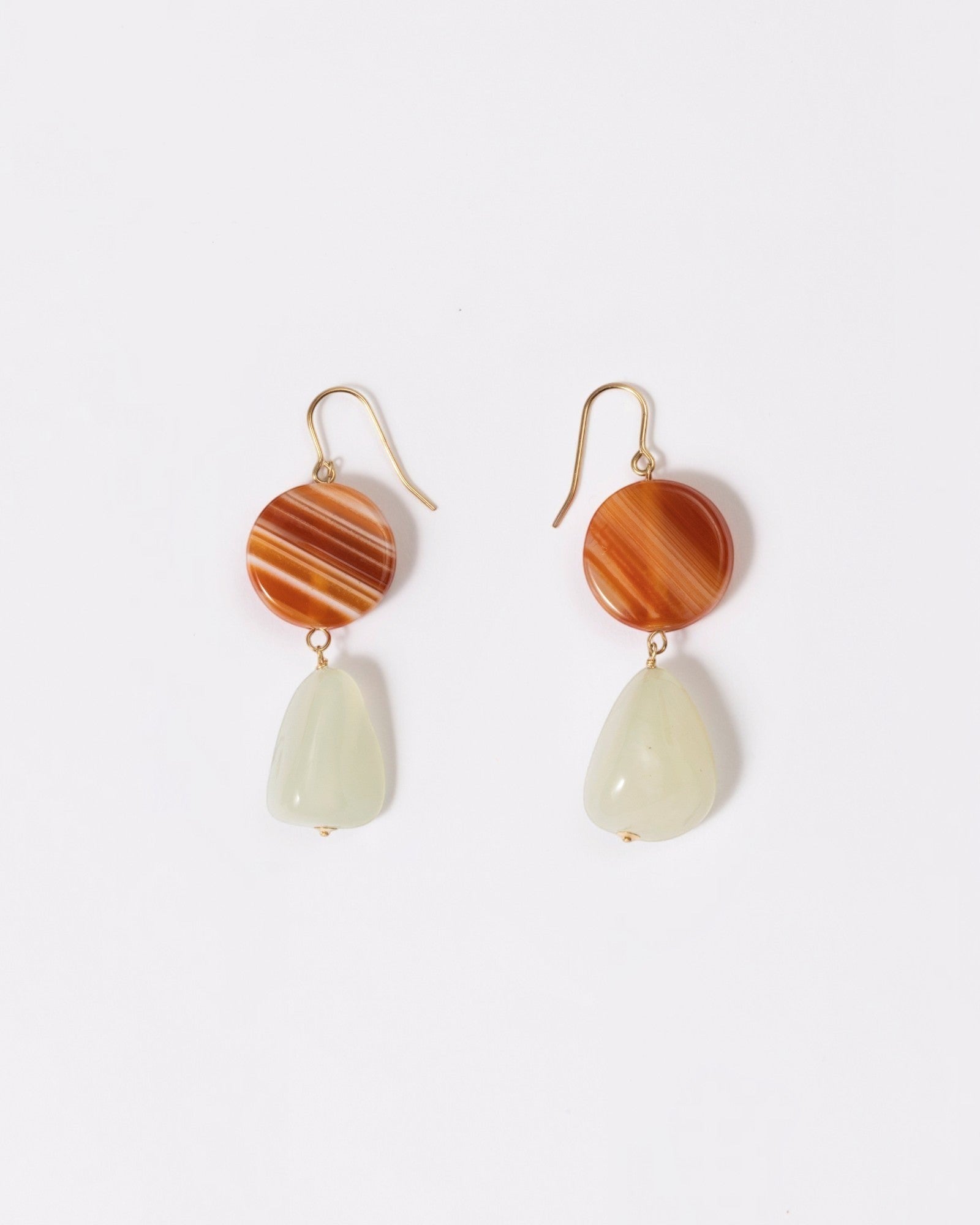 Elsita Jewelry Dawn earrings featuring round red banded agate and triangular Xiuyan jade on 14K gold-filled hooks.