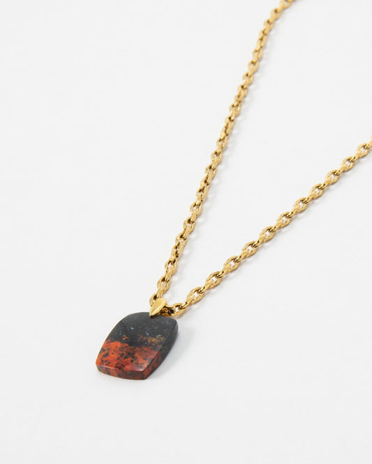 Elsita Jewelry Dune Day necklace featuring a rectangular red and black stone pendant on a gold chain.