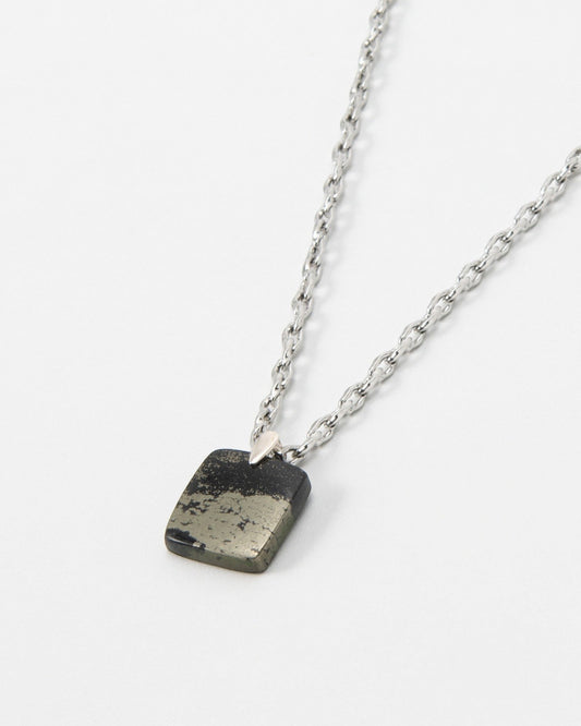 Elsita Jewelry Dune Night necklace featuring a rectangular metallic pyrite pendant on a silver chain