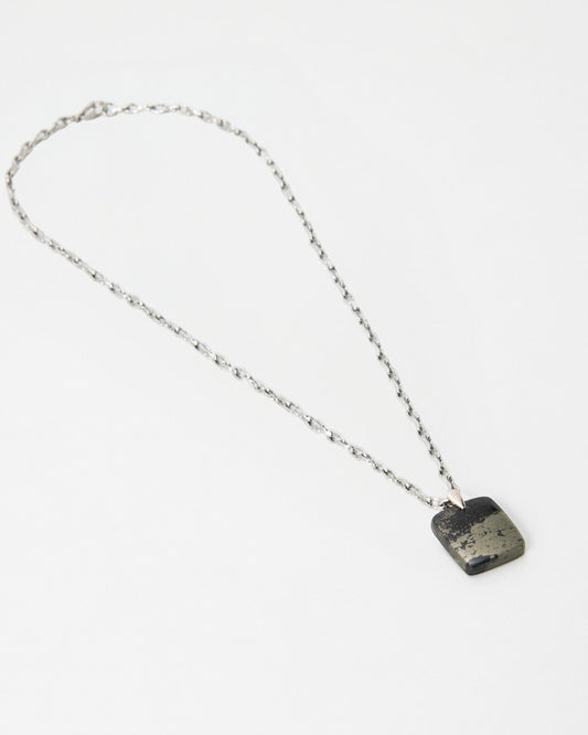 Elsita Jewelry Dune Night necklace featuring a square metallic pyrite pendant on a delicate silver chain