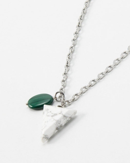 Elsita Jewelry Forest necklace featuring a white marble triangle pendant and a small green stone on a silver chain.
