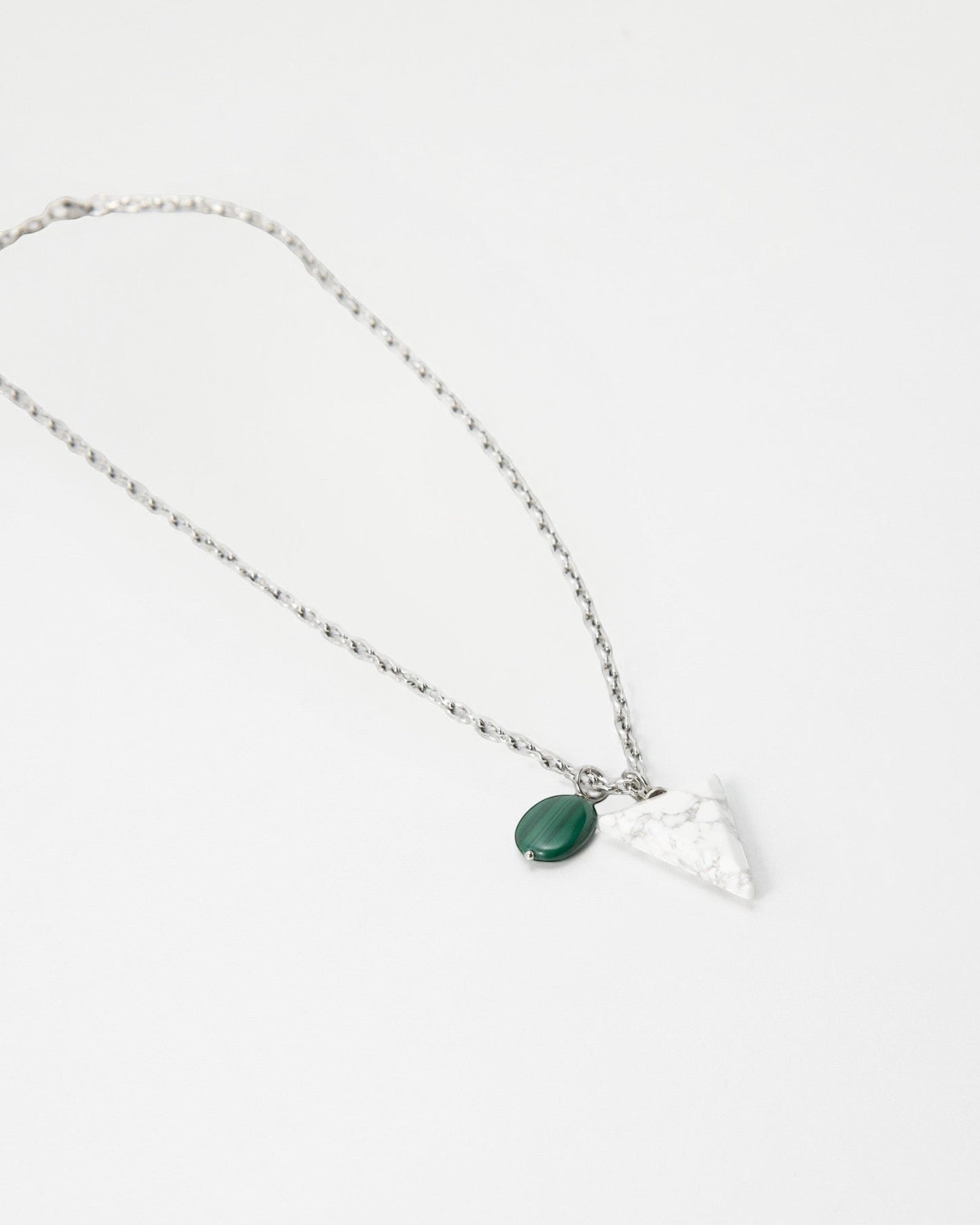 Elsita Jewelry Forest necklace featuring a white marble triangle pendant and a small green malachite charm on a chain