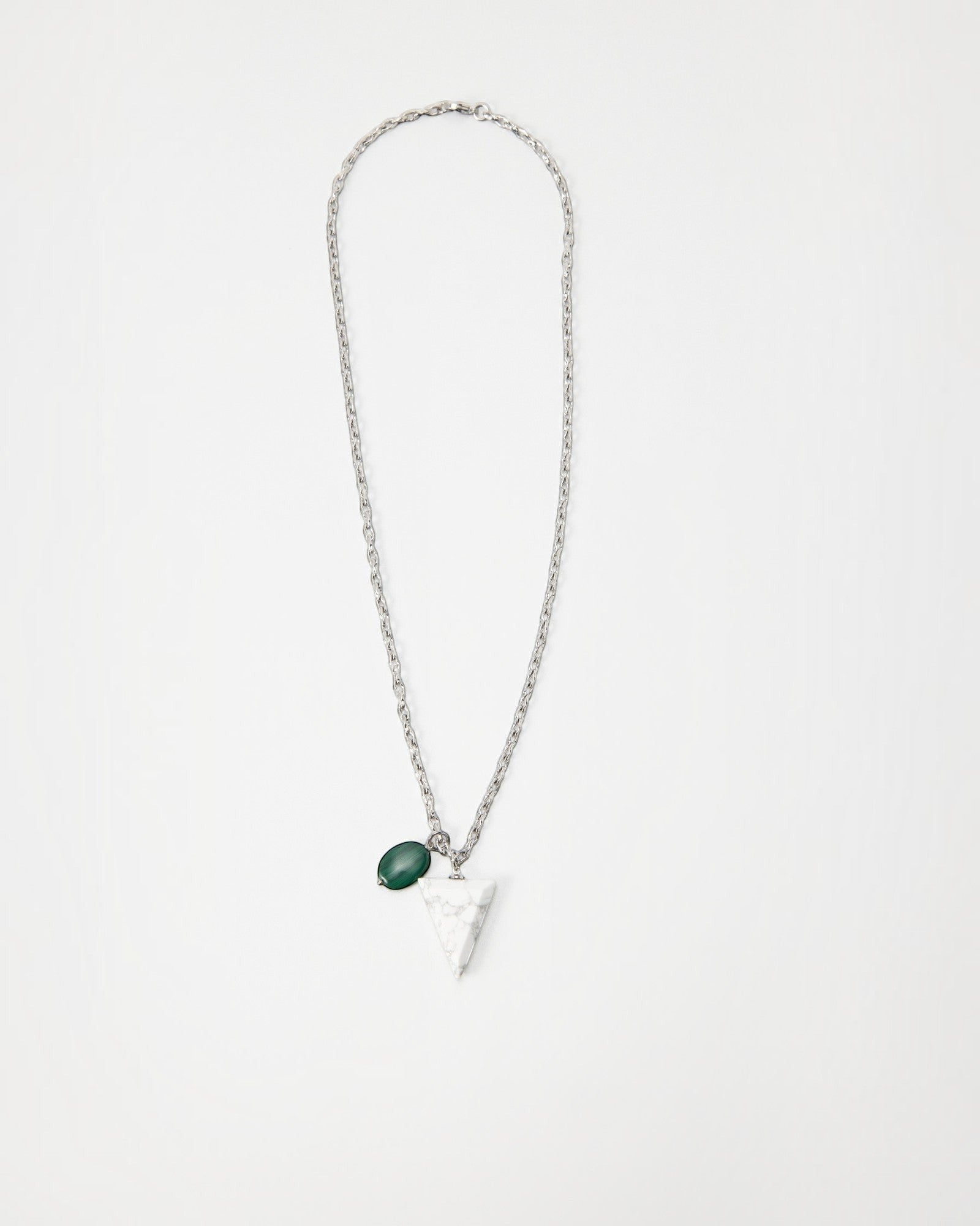 Elsita Jewelry Forest necklace featuring a white marble triangle pendant and a green stone charm on a silver chain.