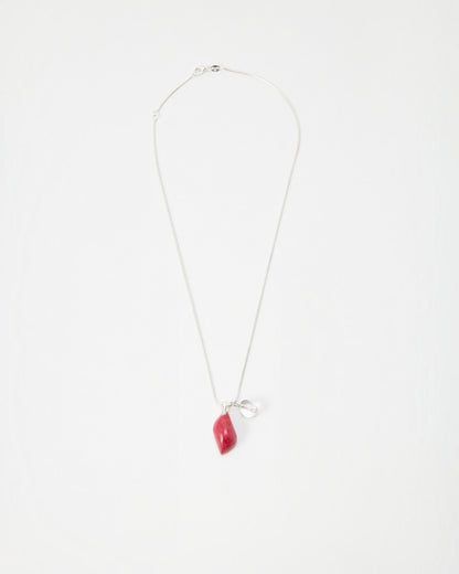 Elsita Jewelry Fuchsia necklace featuring a small red organic-shaped pendant and silver charm on a delicate chain