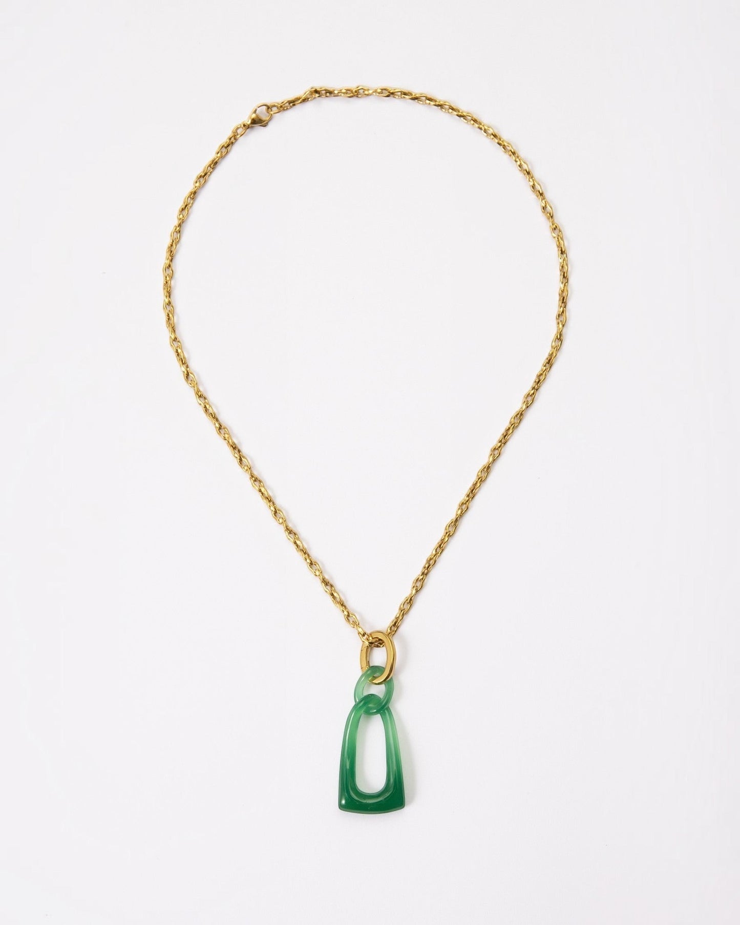 Elsita Jewelry Link Green necklace featuring hand-carved interlocked green agate chain links on a gold-tone metal chain.