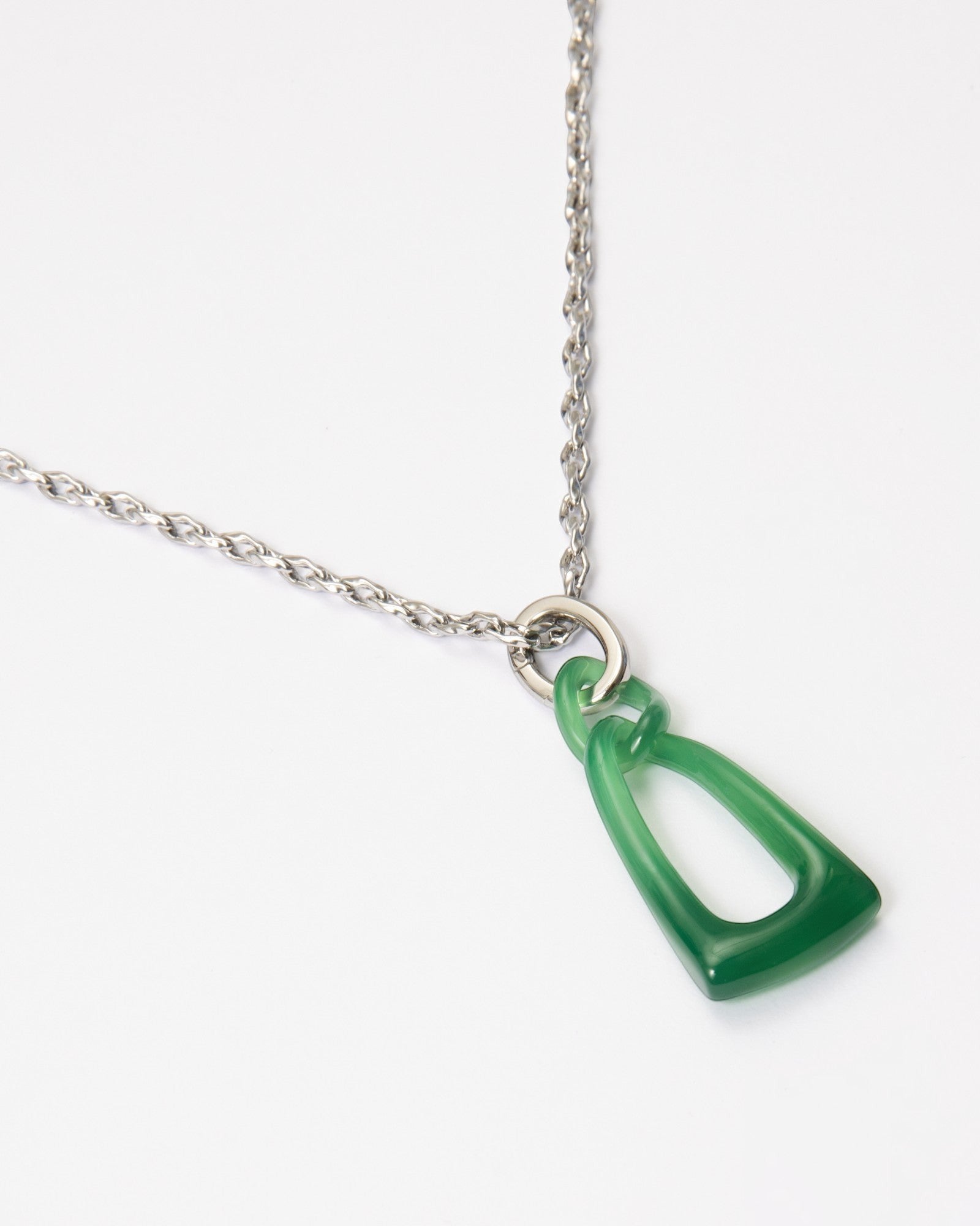 Elsita Jewelry Link Green necklace featuring a hand-carved green agate interlocked chain pendant on a silver chain.