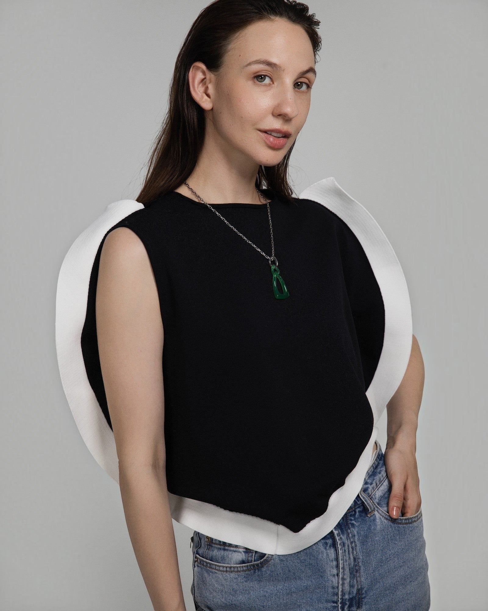 Model wearing an Elsita Jewelry green agate interlocked chain pendant necklace on a silver-tone stainless steel chain.